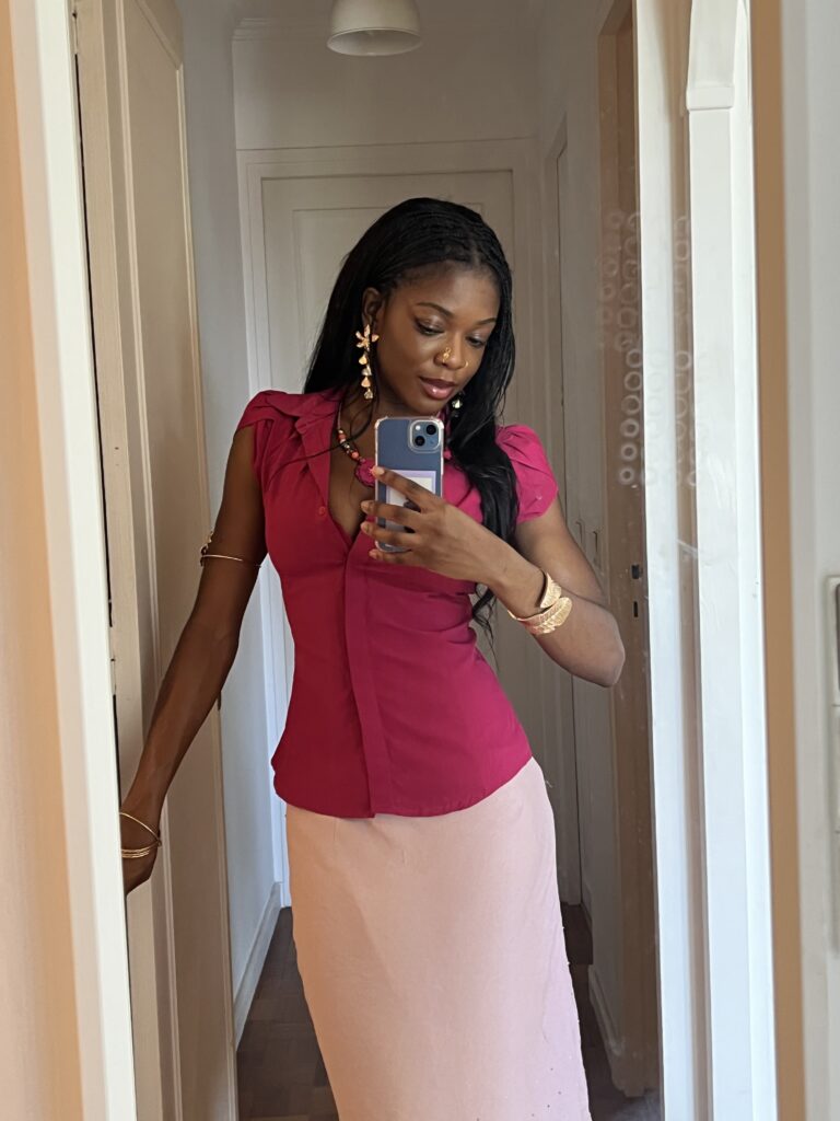Fashion Mirror selfie of me wearing a hot pink top, light pink maxi skirt, and gold-and-pink jewelry, capturing a bold, feminine moment in my personal style journey as I explore expressive color and delicate accessories.