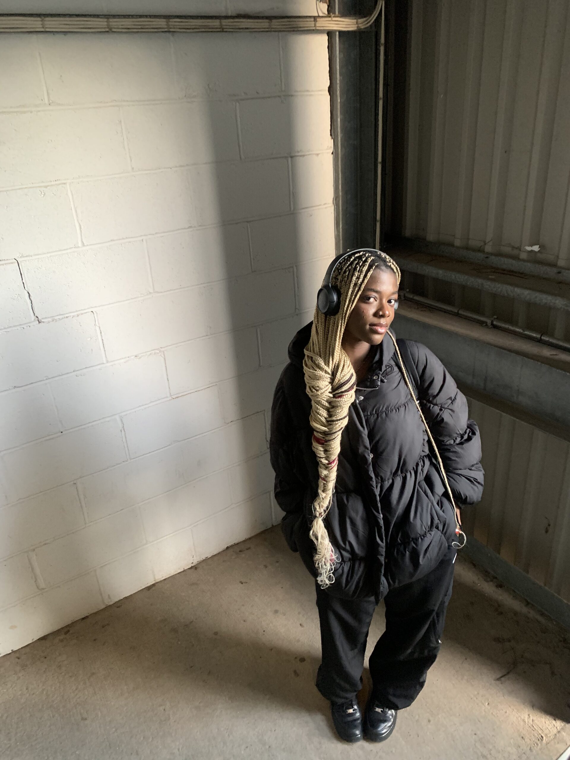 How to actually develop your personal style part 2 Urban streetwear look with an oversized black puffer jacket, Nike joggers, and black Air Force sneakers as part of my style journey