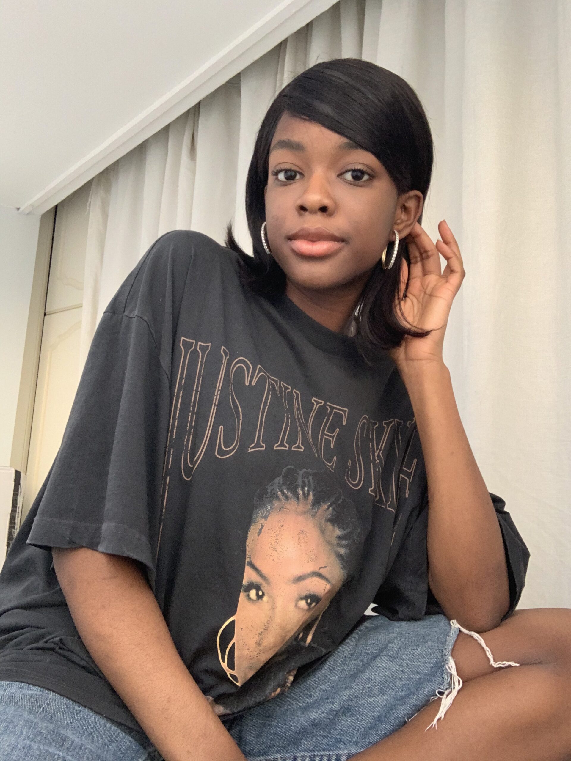 How to actually develop a personal style Photo of me wearing an oversized graphic tee and jorts, showing a laid-back, relaxed outfit that highlights my experimentation with comfortable, everyday personal style.