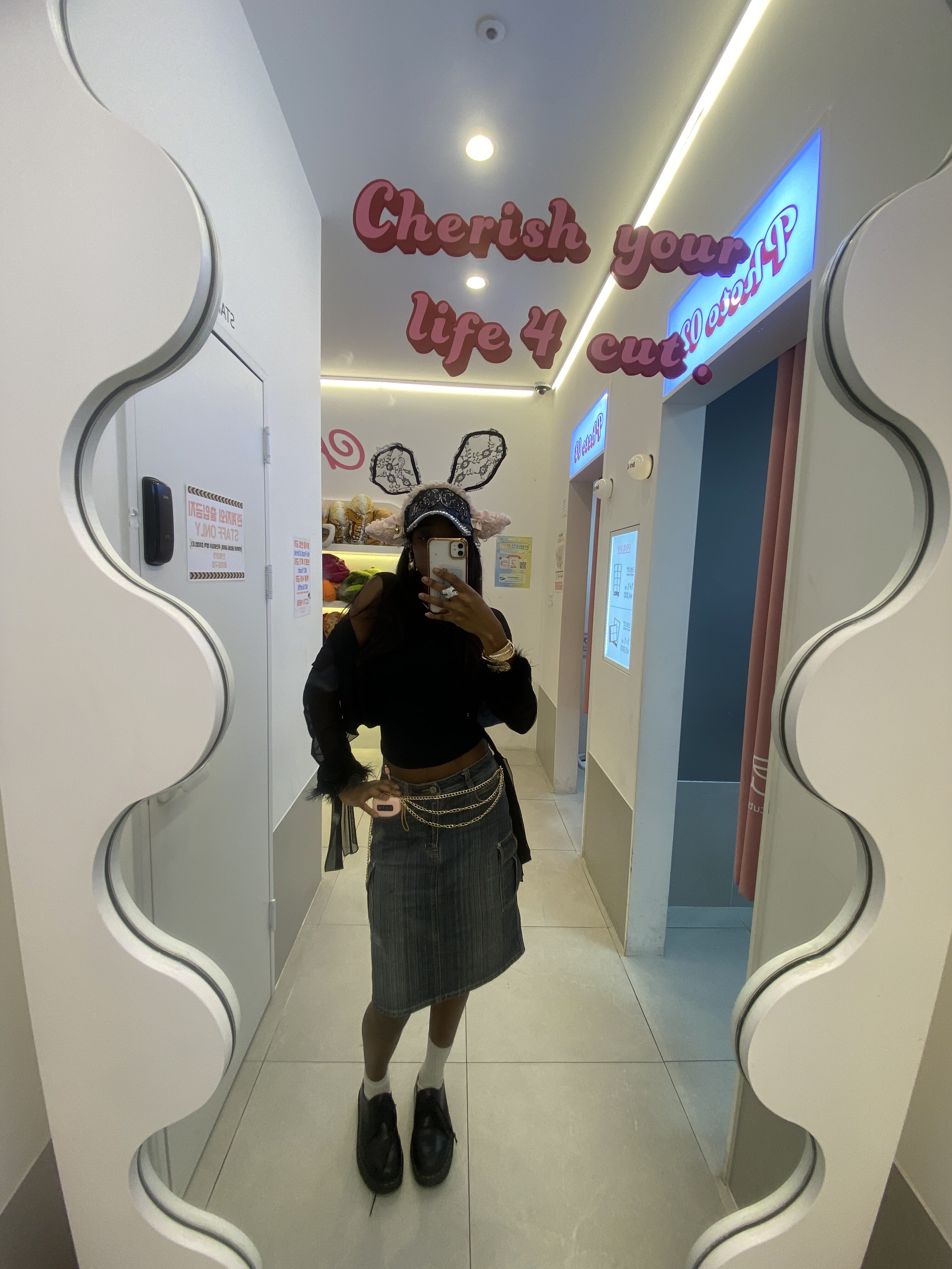 How to actually develop your personal style part 2 Chic layered outfit featuring a denim midi skirt, gold layered hip chain, black cut-out top, and black mesh cardigan