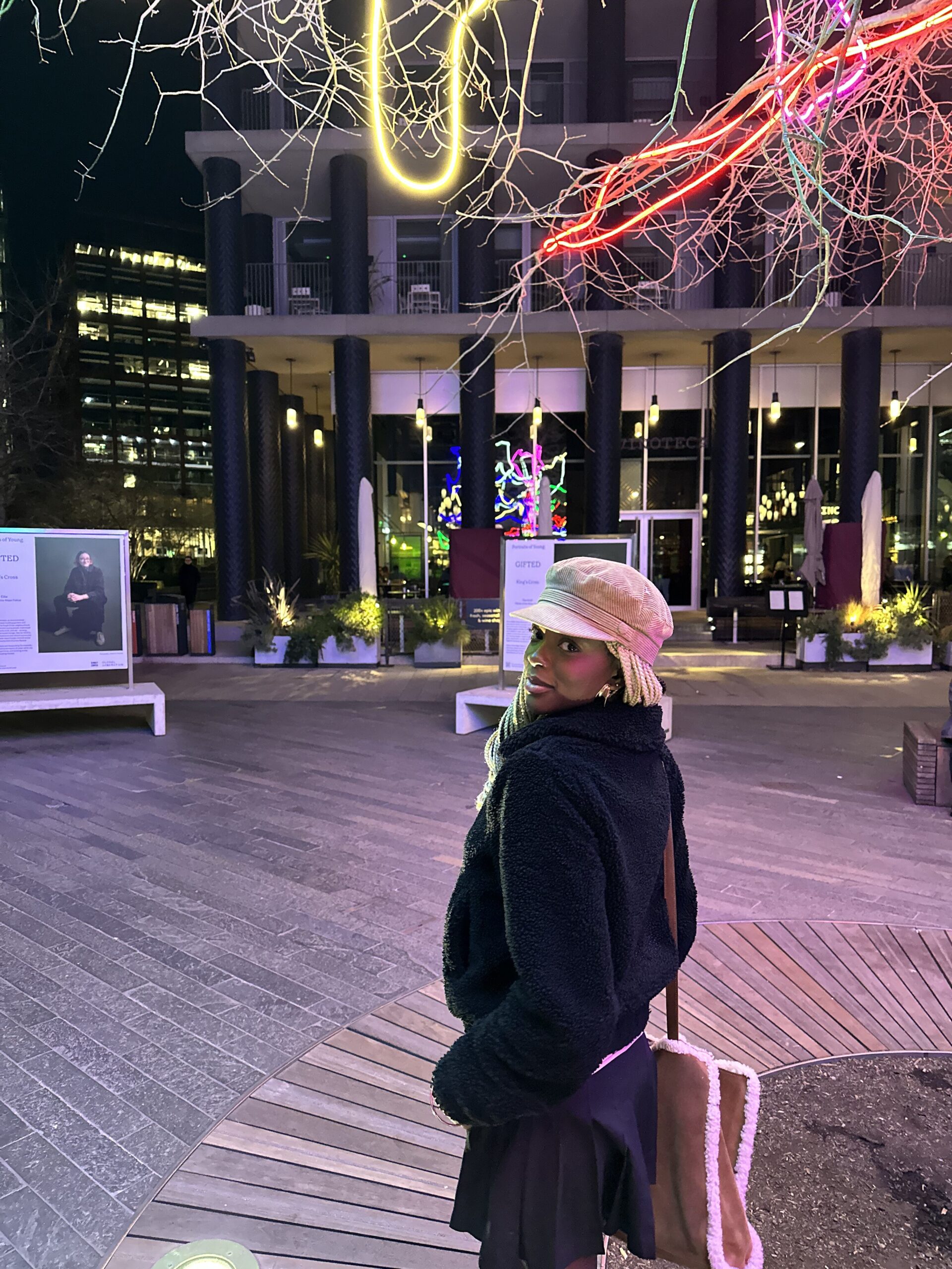 How to actually develop your personal style part 2 Cozy chic look featuring a black skirt, black fluffy jacket, beige baker boy hat, and Ugg Telfar bag showcasing my winter fashion aesthetic