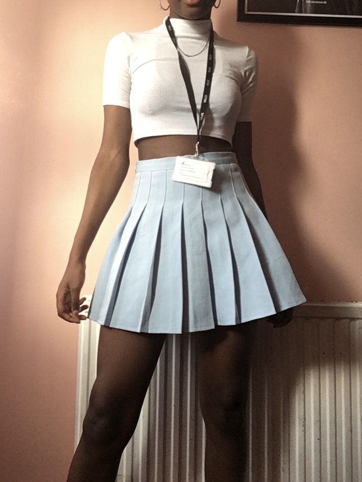 How to actually develop a personal style Photo of me in a white crop top and light blue skirt, embodying a soft, minimal, and clean aesthetic during a period of discovering lighter, airy elements in my personal style.