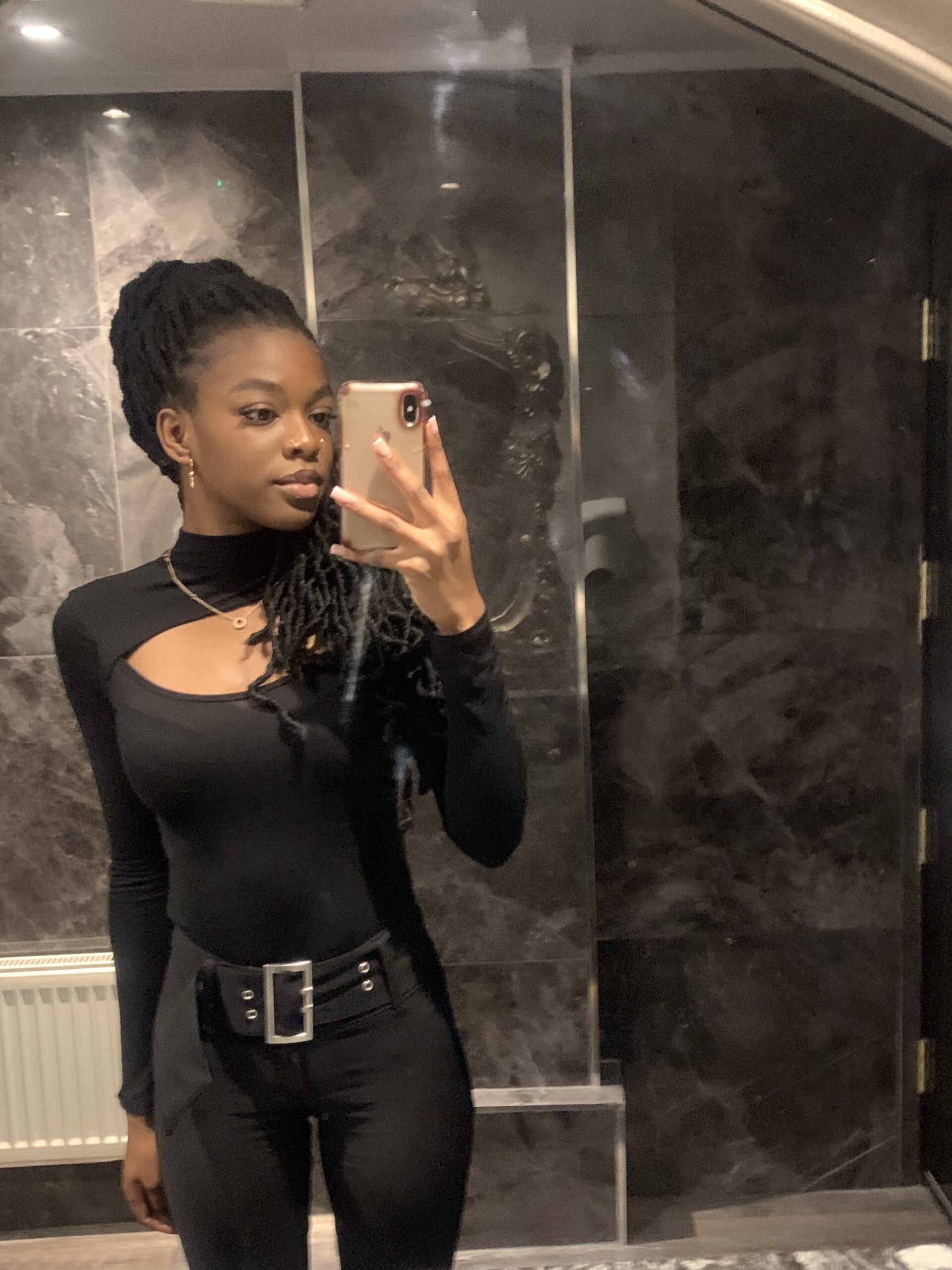 How to actually develop your personal style part 2 Edgy all-black outfit with flared trousers, a black belt, and a long-sleeve cut-out top reflecting my evolving aesthetic