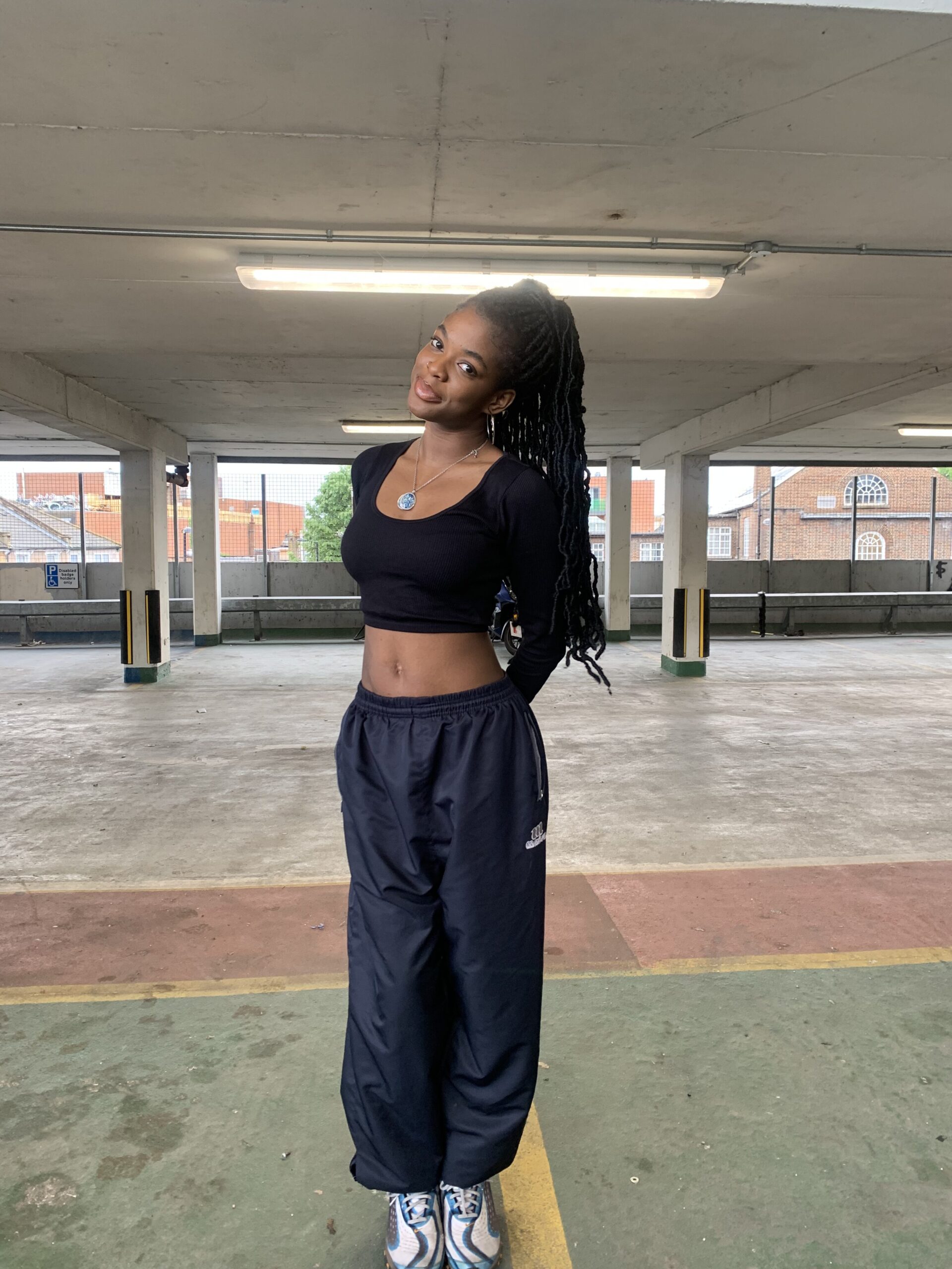 How to actually develop your personal style part 2 Streetwear outfit featuring baggy sports joggers and a cropped black long-sleeve top showing my relaxed style