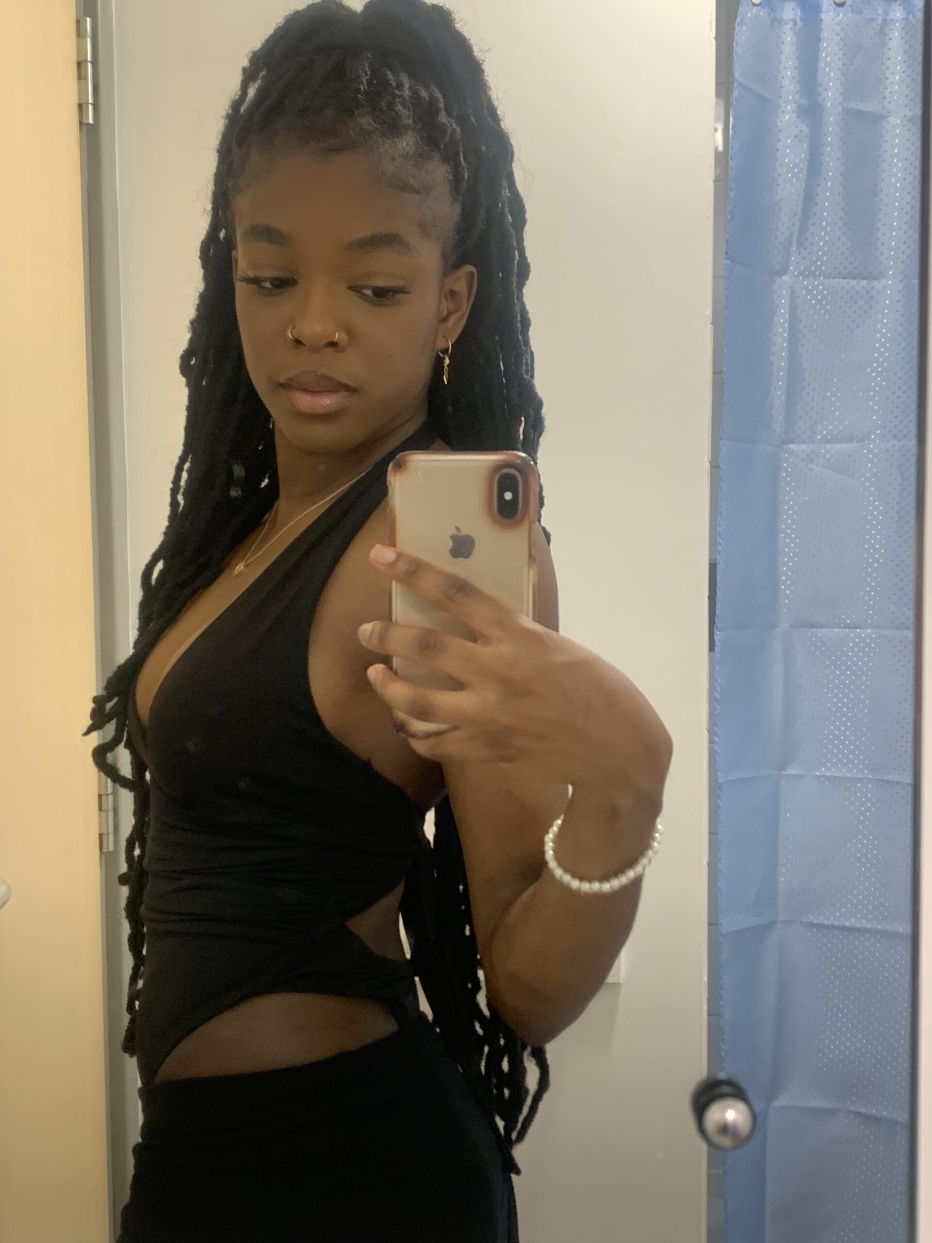 How to actually develop your personal style part 2 Cut-out black swimsuit paired with a black mini skirt capturing a bold summer fashion moment