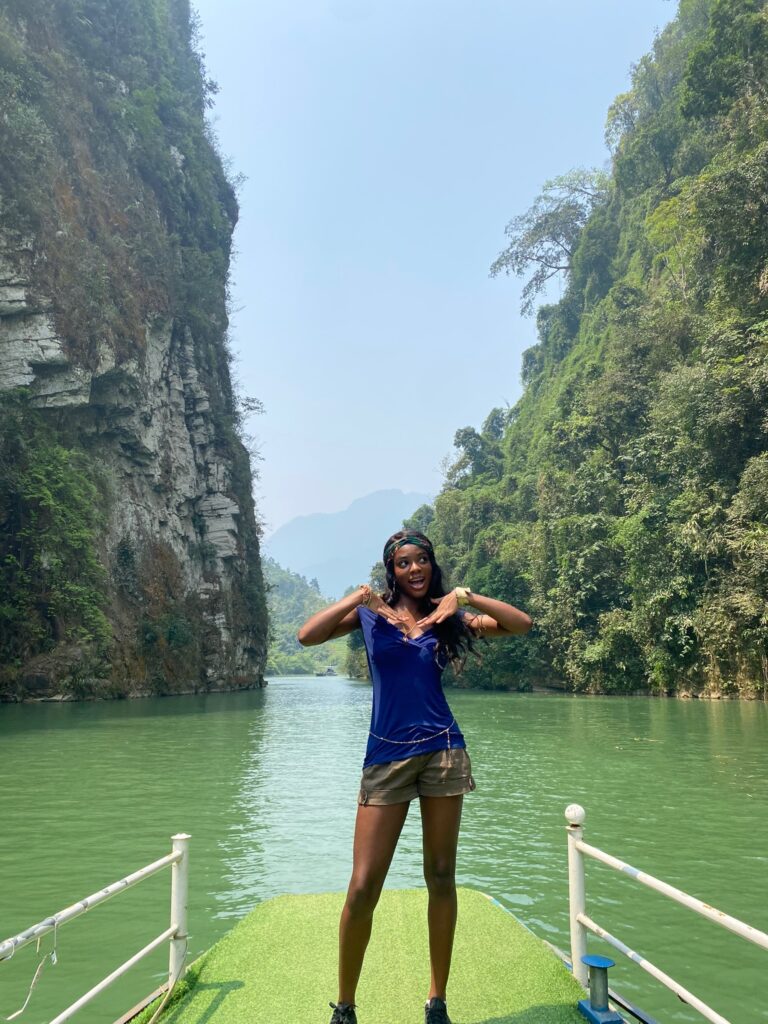 Boat cruise through scenic landscapes in Northern Vietnam, a peaceful stop on a 2 week Northern Vietnam itinerary