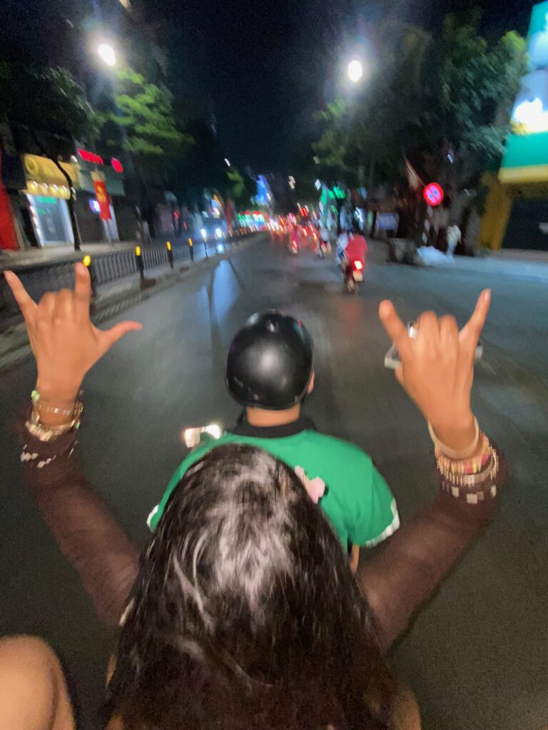 Riding a Grab motorbike through Hanoi Old Quarter on an exciting short Northern Vietnam trip